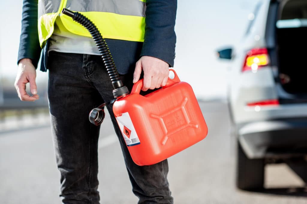 Man with refuel canister on the roadside. Fuel Delivery Service OKC